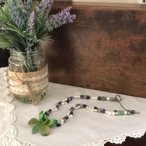 Orchid and gemstone necklace